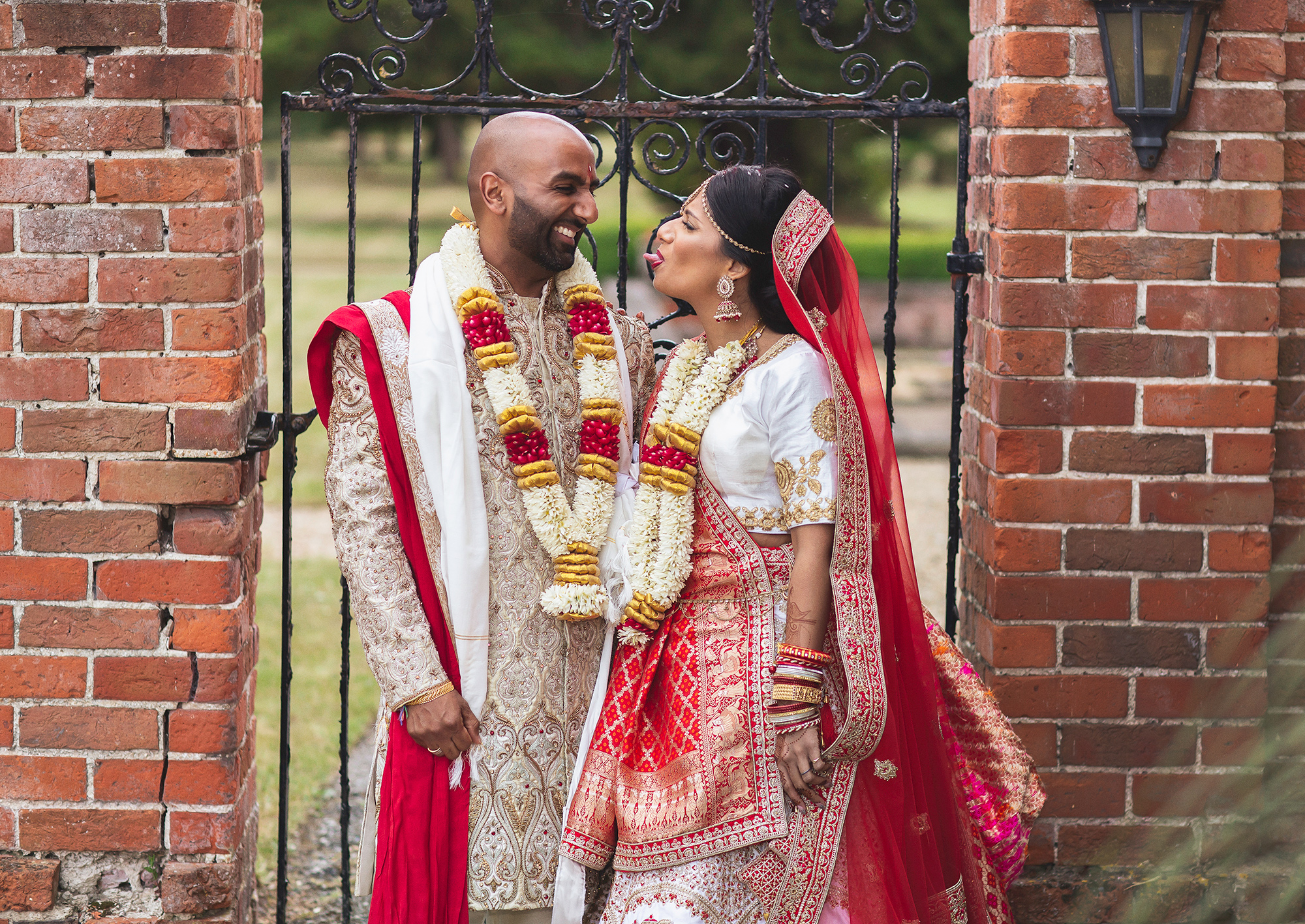 Hindu-wedding-couple-having-fun-Warbrook-House-garden (listing)