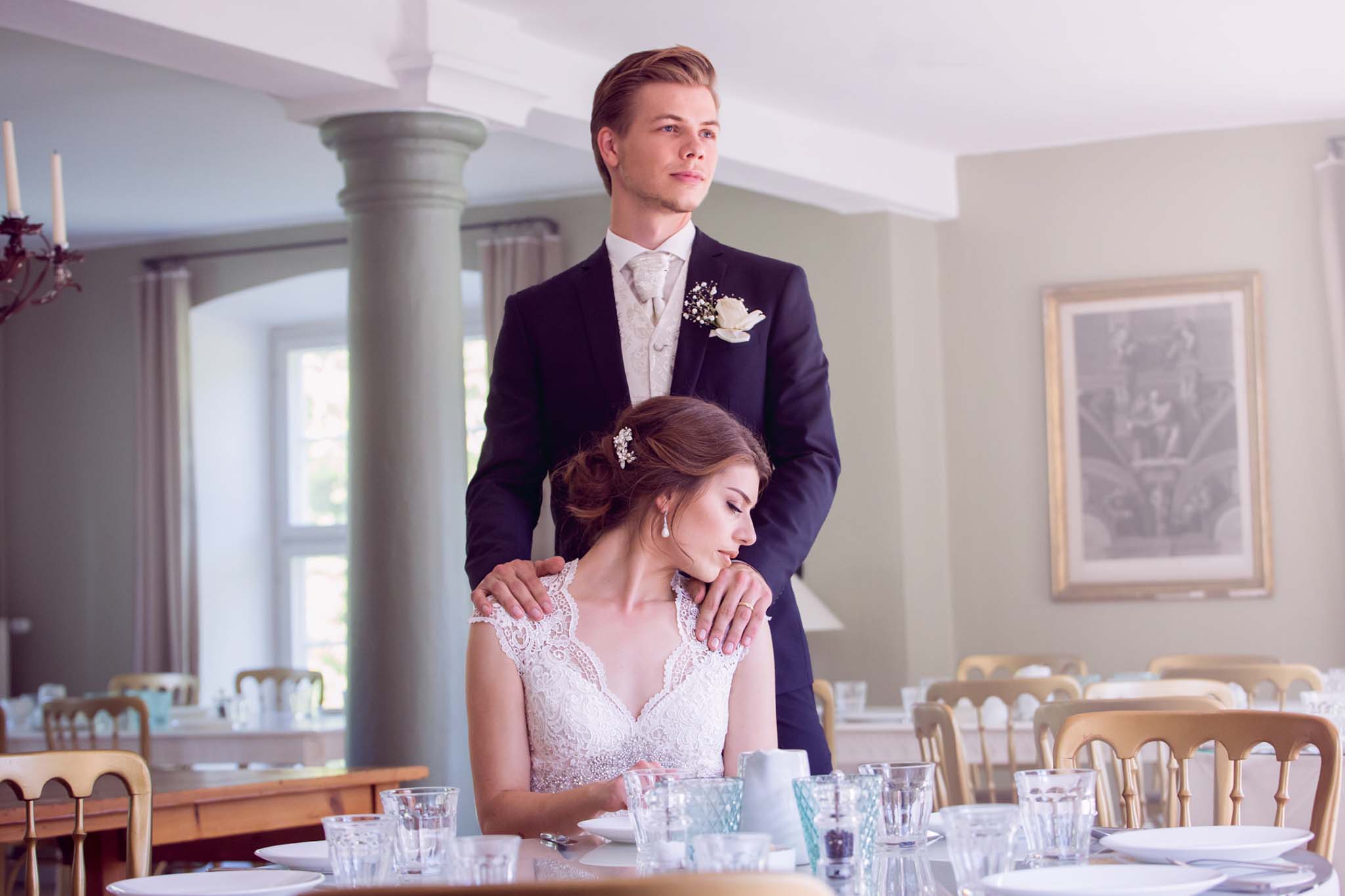 A fairytale wedding with a bride and groom at their table. (listing)