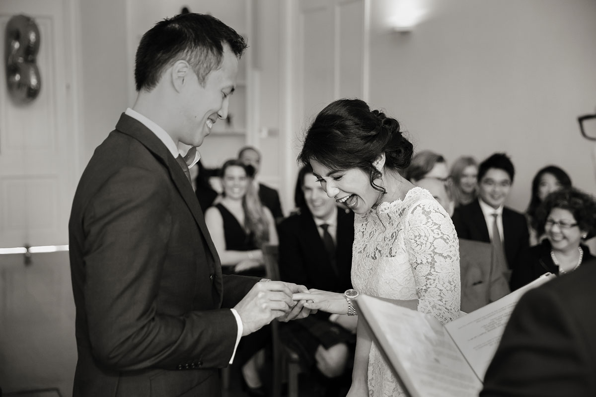 London-wedding-couple-exchanging-rings-at-Asia-House-photo (listing)