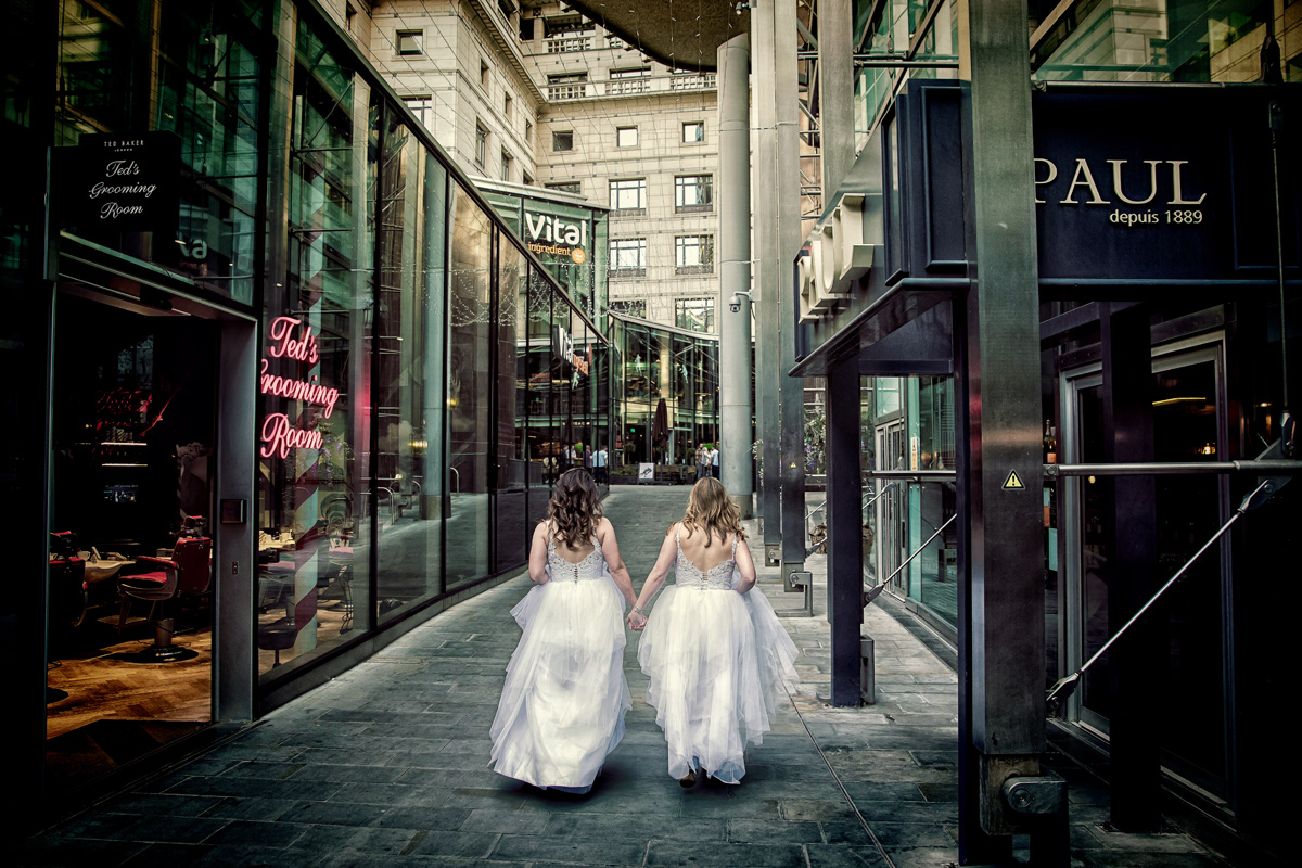 Two-brides-just-married-walking-through-London-streets (listing)