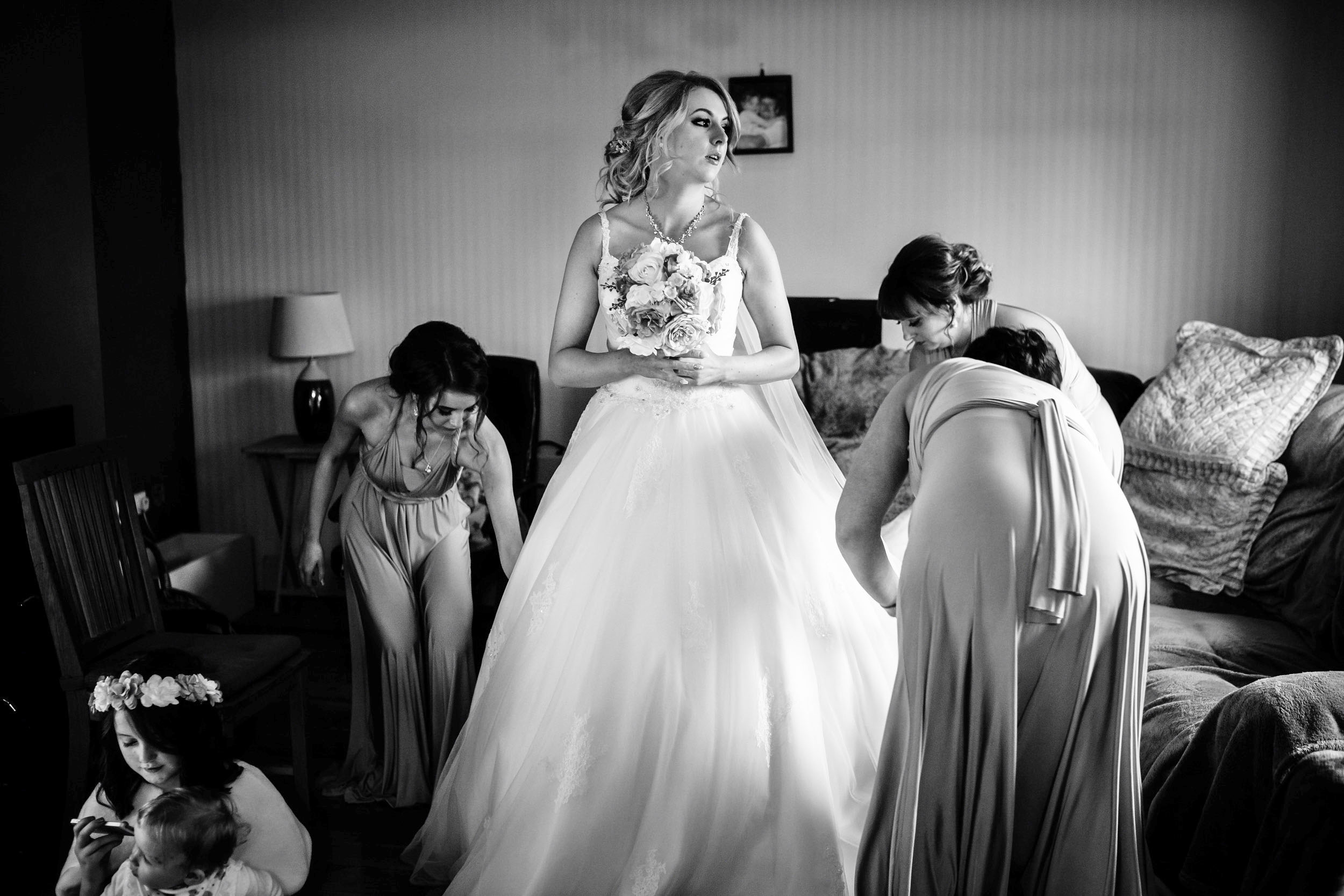 A bride getting ready with her bridesmaids for a cheap wedding in London. (listing)