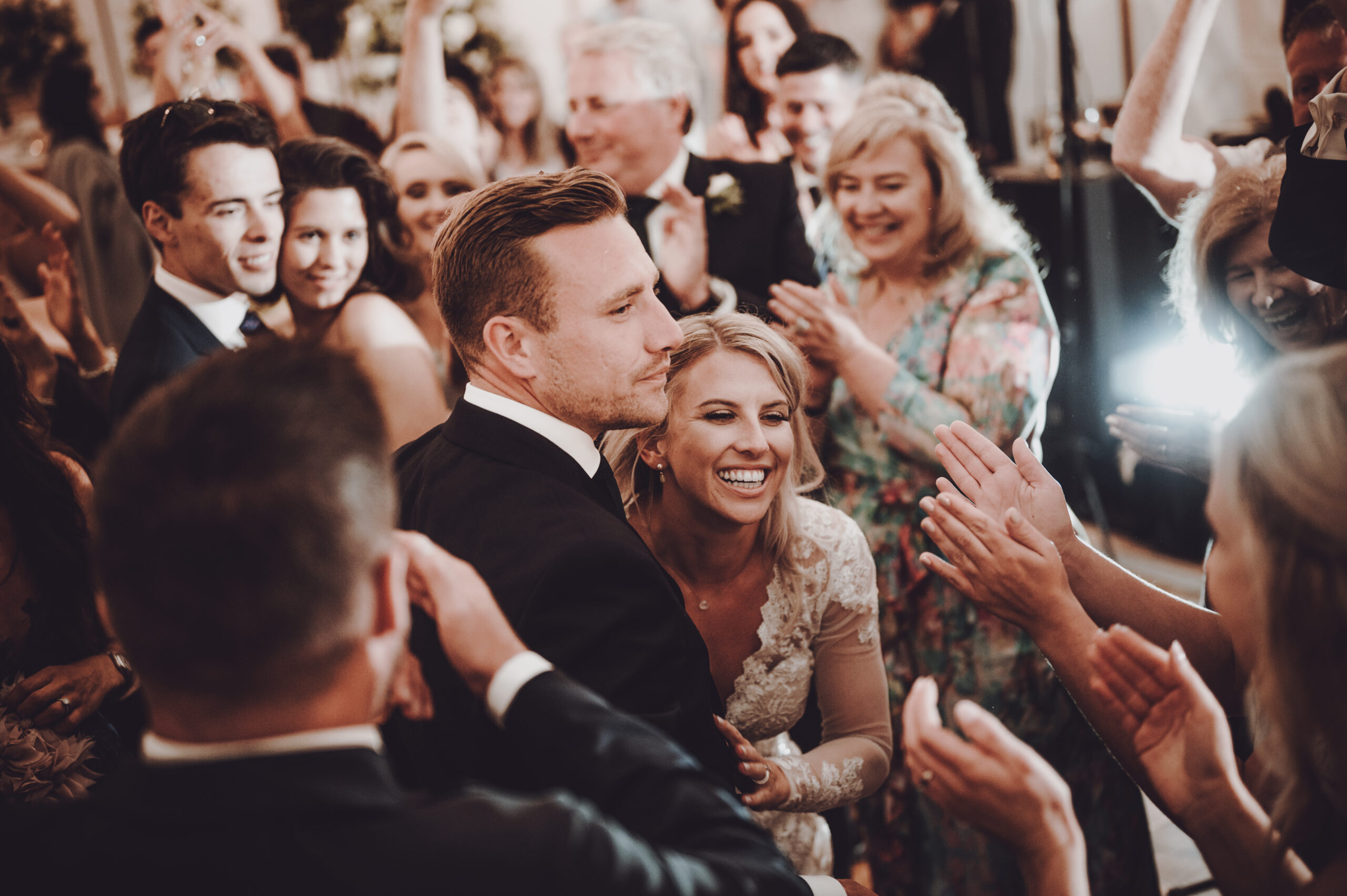 A bride and groom dance at a wedding reception. (listing)