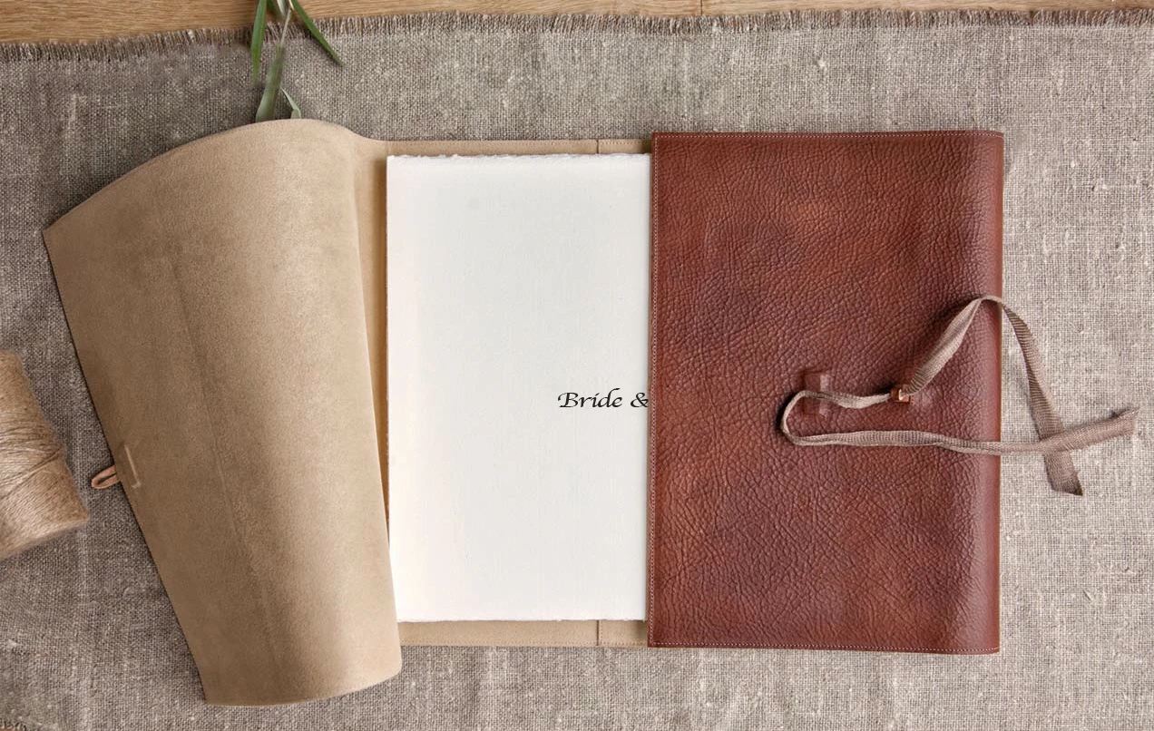 A brown leather book with a notepad on top. (listing)