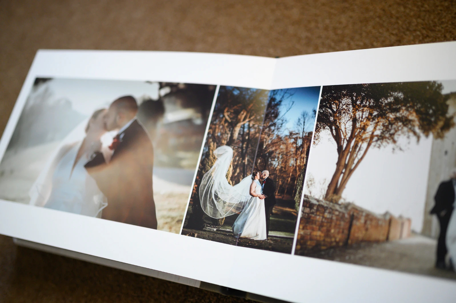 A wedding album with photos of a bride and groom. (listing)