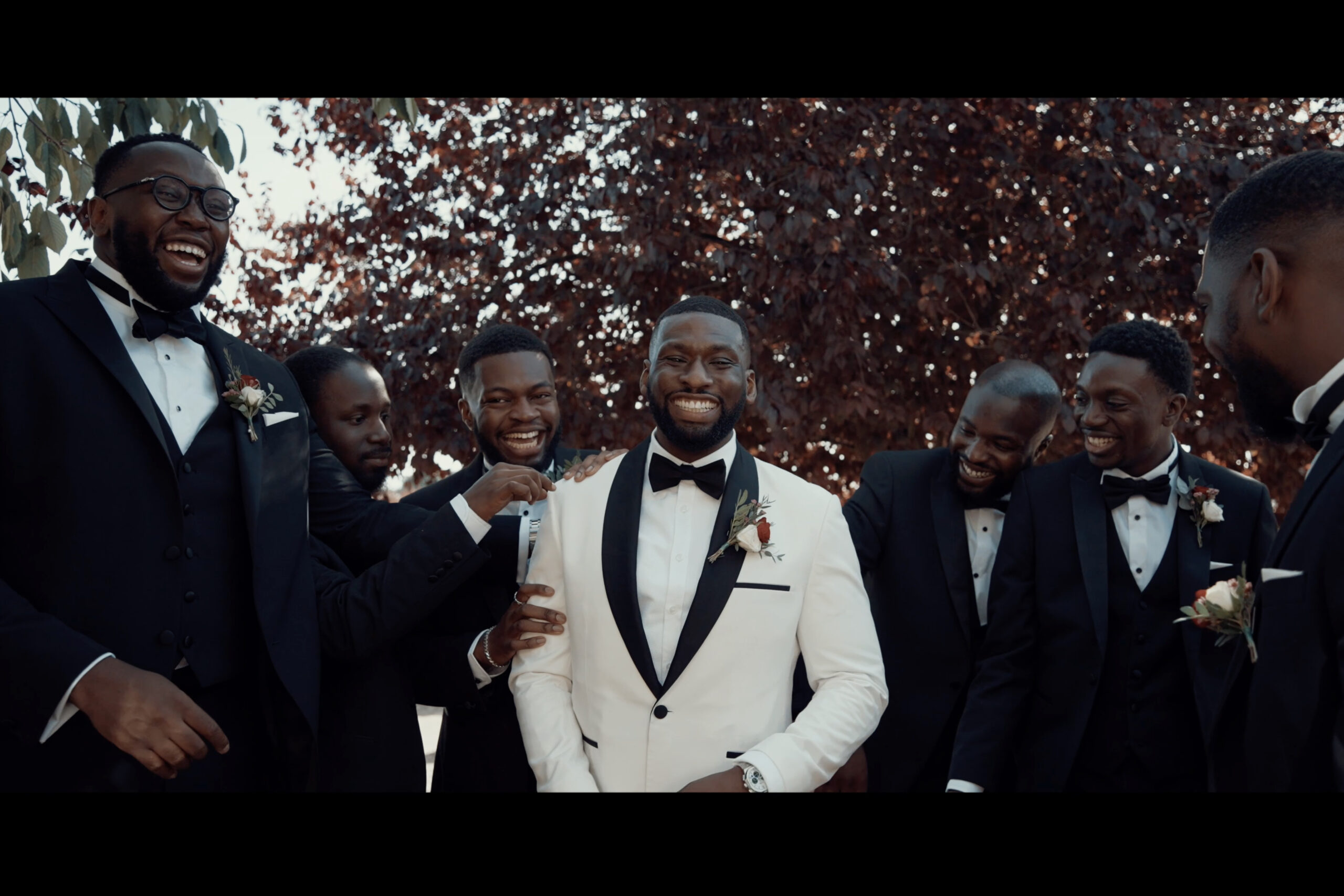 A group of groomsmen in tuxedos and tuxedos. (listing)
